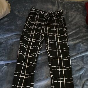Black and white checkered pants with a tie in the front. Size XL SHEIN